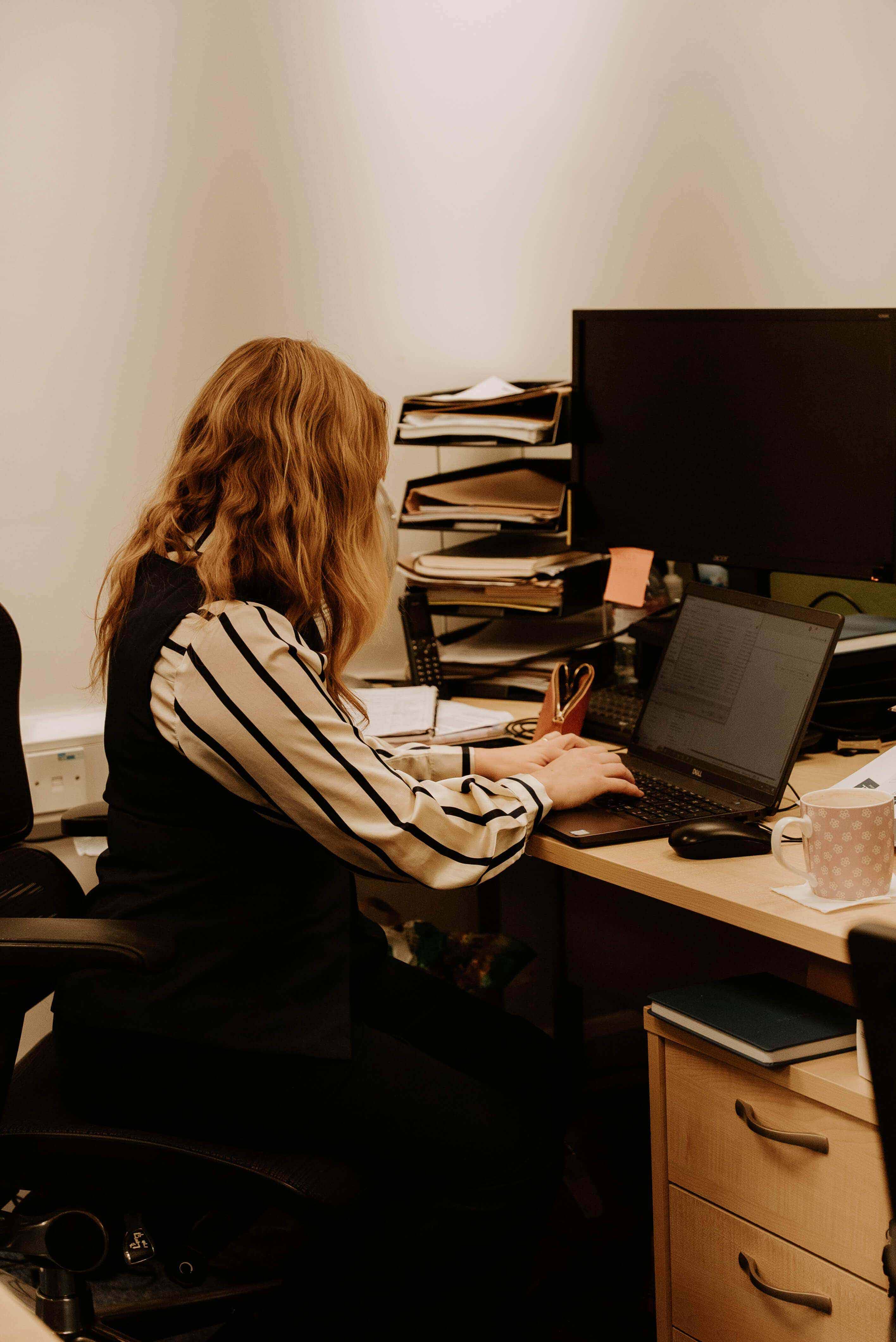 A team member using a computer at Parkhall office